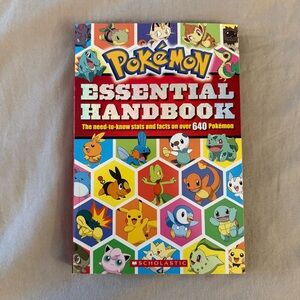 Scholastic Pokémon Essential Handbook - Vibrant Cover